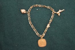 An 18ct gold bracelet set with a heart shaped charm and two other items.