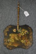 A Victorian papier mache hand fan painted with peacocks and flowers.