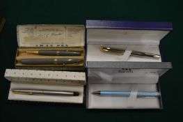 Various boxed pens.