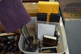 A table lamp, picture frame, hip flask etc.