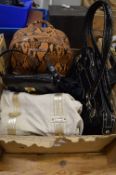 A quantity of ladies handbags.