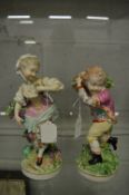 A pair of 19th century porcelain figures of a young boy and girl.