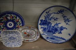 A large Japanese blue and white charger (cracked) and three other dishes.