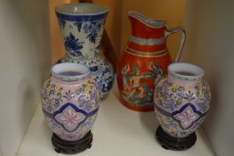 A pair of enamel decorated pink opaque glass vases on stands and two other items.