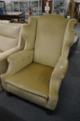 A Georgian style wing armchair.