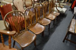 A set of five ash, beech and elm Windsor style dining chairs.