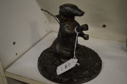 Heavy bronze figure of a bear with a collar.