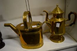 Brass watering can and a brass coffee pot on stand.
