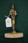 A small cast bronze figure of the Egyptian god Ptah mounted on a marble base.