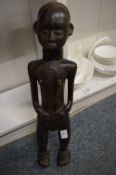 A large African carved wood standing figure.