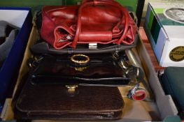 A quantity of ladies handbags.