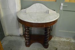 A Victorian mahogany and marble top demi-lune wash stand.