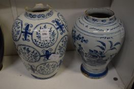 Two 19th century or earlier delft vases.