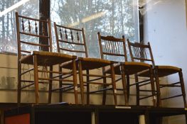 Two pairs of rush seated chairs.