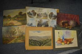 A small group of unframed oil paintings and art work.
