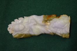 A Chinese carved lavender jade pendant of a female deity.