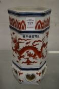 A Chinese hexagonal shaped hat vase painted with dragons.
