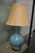 A large Chinese pottery vase/lamp.