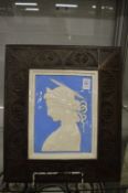 A Della Robia porcelain plaque depicting a profile portrait of a young lady mounted in a carved wood