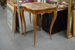 A French style king wood and ormolu shaped top centre table.