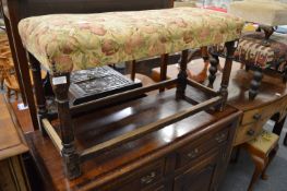 An oak framed and upholstered stool.