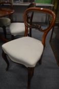 A matched set of six Victorian mahogany balloon back dining chairs.