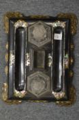 A Victorian papier mache gilded and inlaid desk stand with pair of cut glass inkwells.