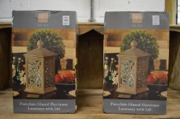 A pair of porcelain lanterns.