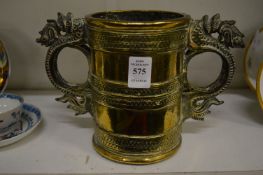 A heavy cast bronze twin handled vessel, possibly Chinese.