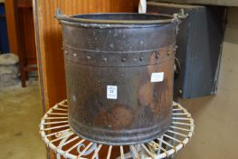 A copper coal bucket.