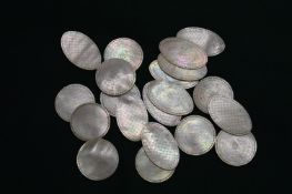 A bag of Chinese mother of pearl counters.