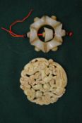 Two Chinese carved jade amulets.