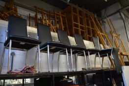 A set of six chrome framed dining chairs.