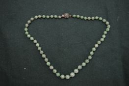 A jade bead necklace.