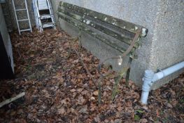 An old wrought iron bench frame, 277cm long.