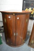 A 19th century mahogany hanging corner cupboard.