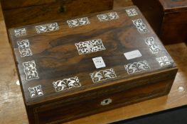 A Victorian rosewood and mother of pearl inlaid writing slope.