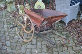 An old French cast iron and wooden grape crusher.
