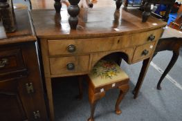 A 19th century bow front sideboard.