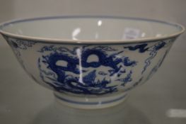 A Chinese blue and white dragon bowl.