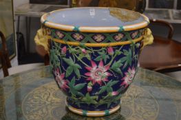 A large majolica jardiniere (repaired).