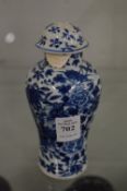 A small Chinese blue and white vase and cover (faults).