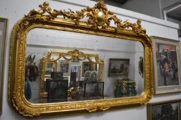 A decorative gilt framed rectangular wall mirror.