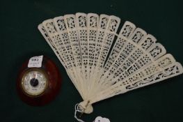 A fan and a desk thermometer.