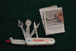 A Swiss Army style sewing knife.