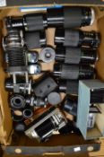 A quantity of camera lenses.
