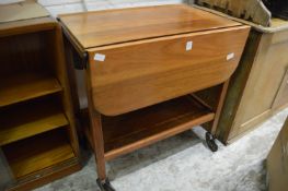 A teak drop-flap two-tier trolley.
