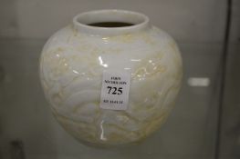 A Chinese vase with incised decoration of dragons.