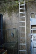 An aluminium two section ladder.