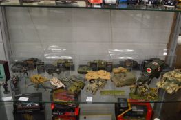 A quantity of military vehicles to include tanks etc.
